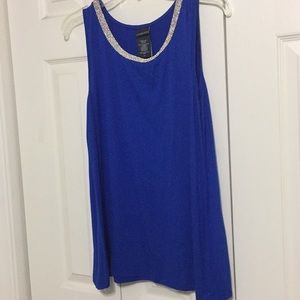 Cobalt blue sleeveless blouse with silver neck.